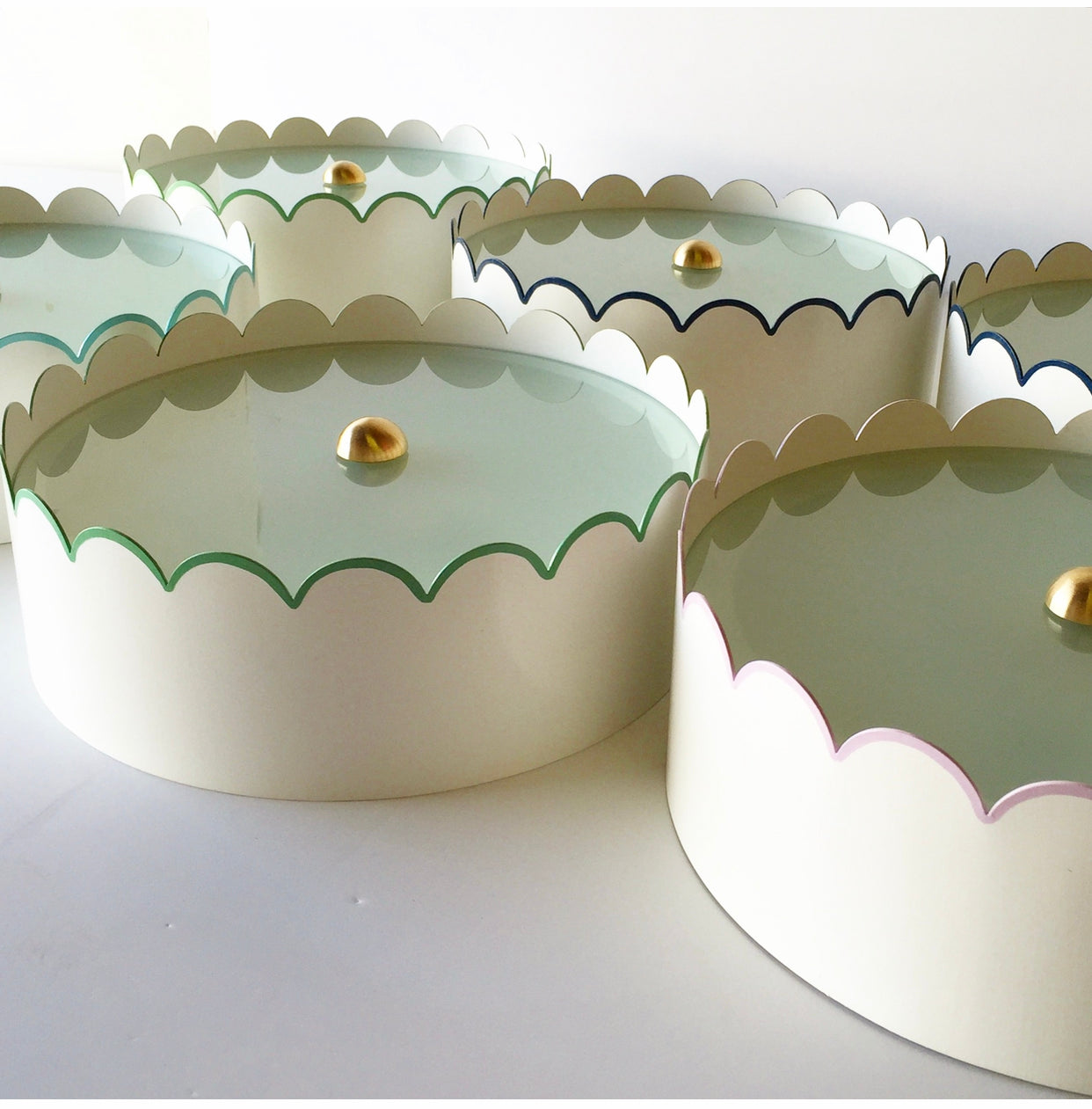 A Group of Ivory Scalloped Flush Mounts w/ Various Trim Colors